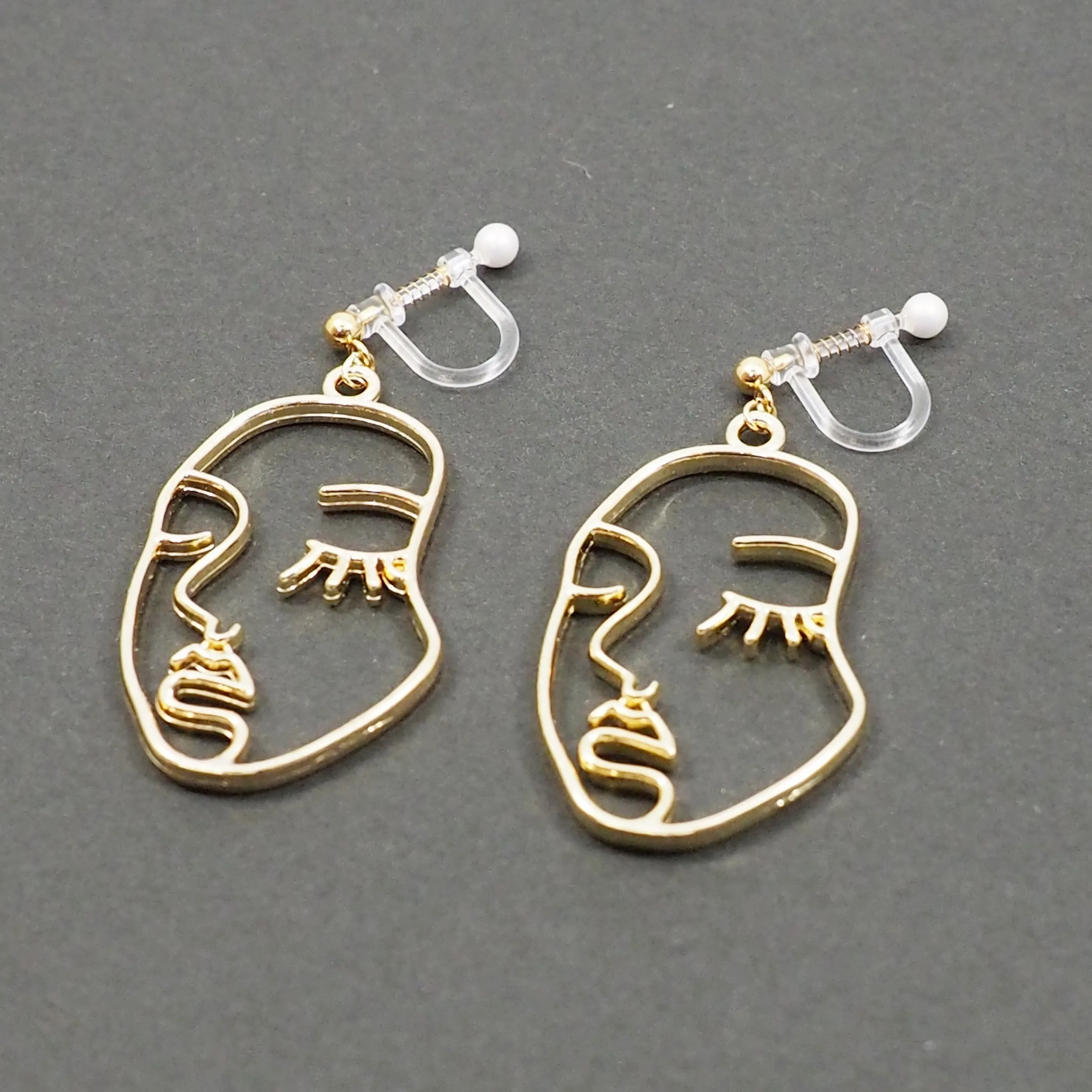 Gold Picasso Face Closed Eyes Invisible Clip On Earrings