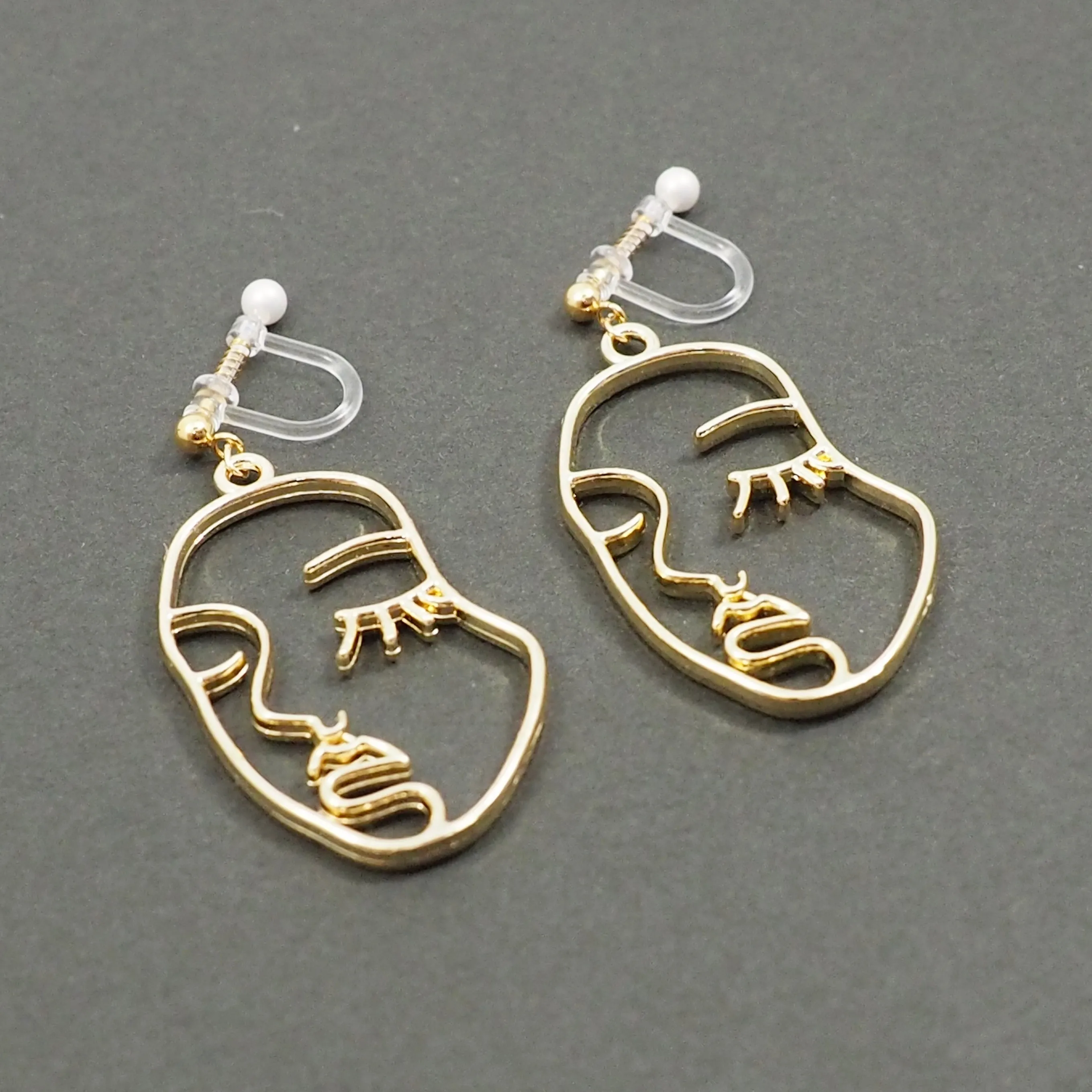 Gold Picasso Face Closed Eyes Invisible Clip On Earrings