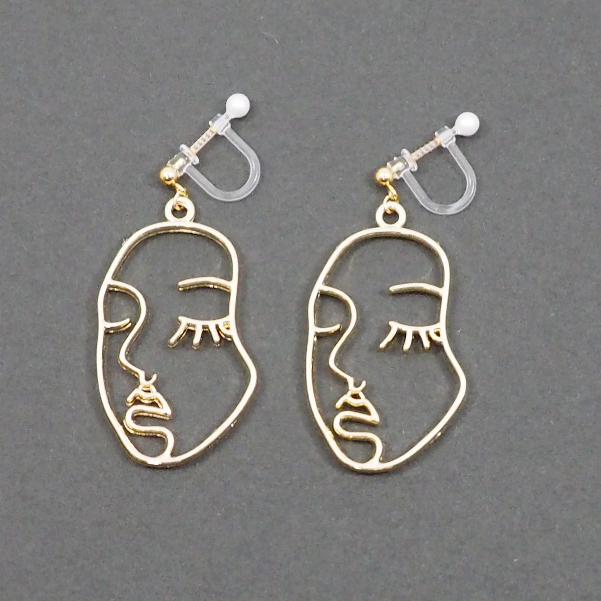 Gold Picasso Face Closed Eyes Invisible Clip On Earrings